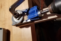 Drill into the hole with the bit until the stop hits the jig.