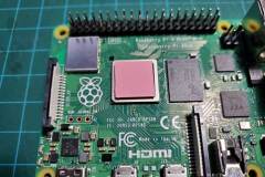 Note the thermal tape on the CPU to ensure contact with the fan and heatsink