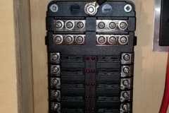 Main fuse panel with hot and ground connected, ready for circuits.