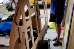 Test fitting the template to the floor. Since the length of the trailer is a touch over 9 ft, and plywood ends at 8 ft, I had to tack on the last bit, and you can see the braces in the foreground of the template.