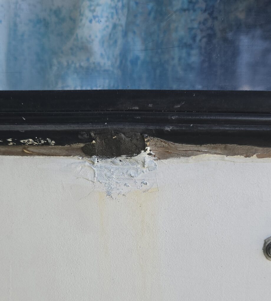 Detail of original lower hardware removed, epoxy puttied and painted