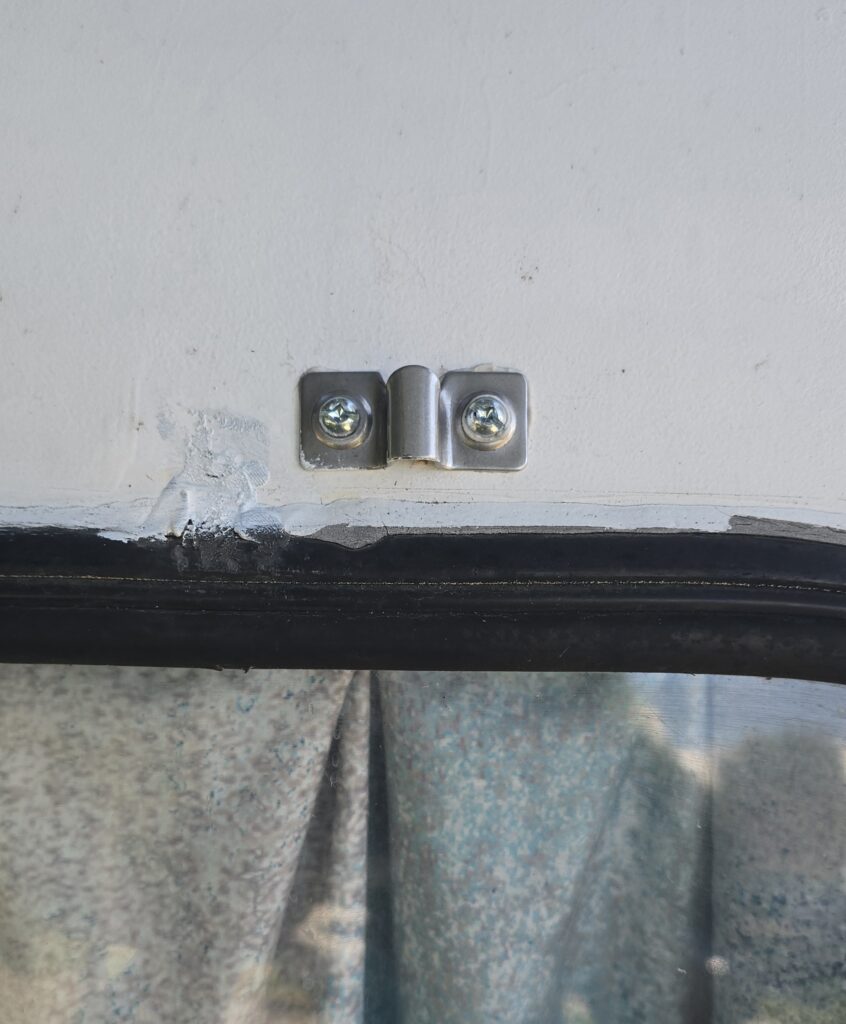 Detail of Upper Hardware installed and old hardware removed and filled with epoxy putty